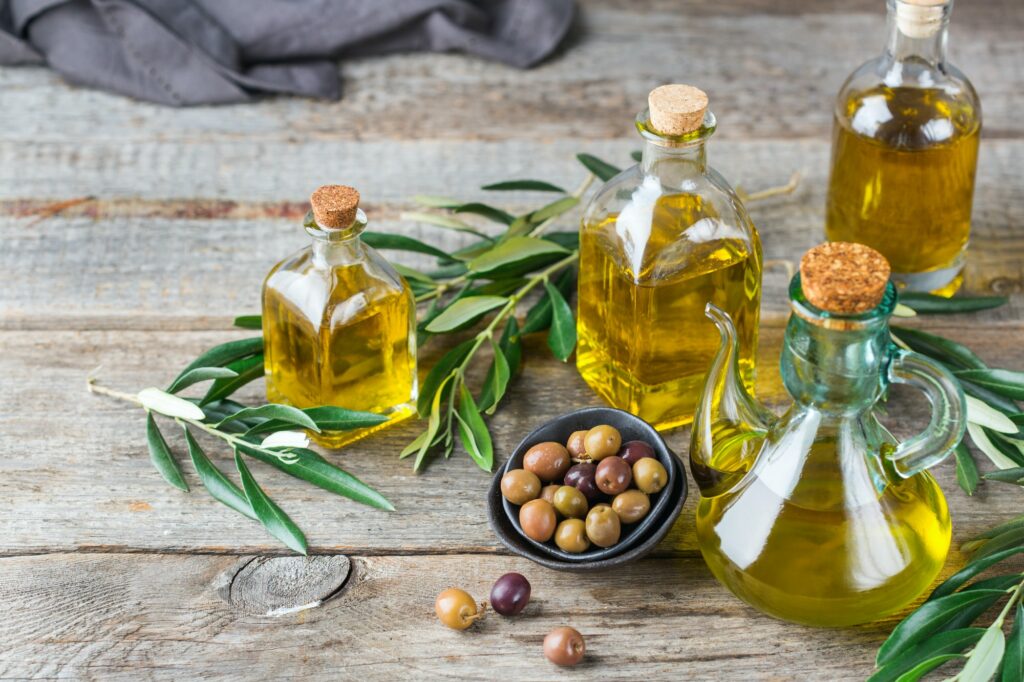 Assortment of fresh organic virgin olive oil in bottles