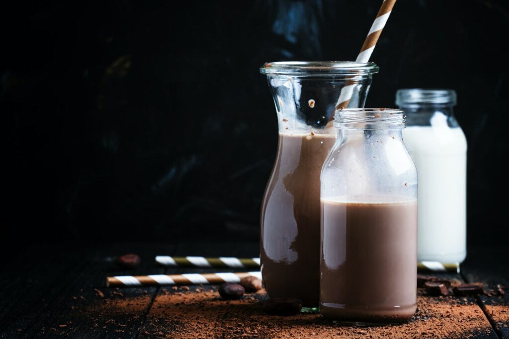 Cocoa or milk with chocolate, glass bottles