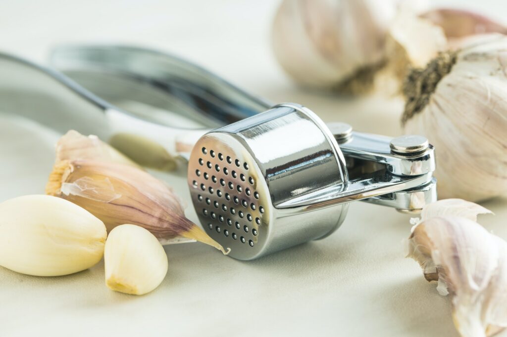 Garlic and garlic press.